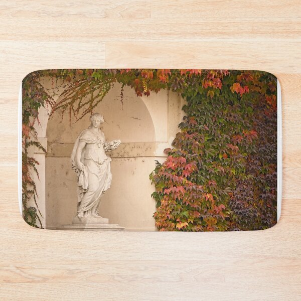Item preview, statue and wall with creeper plant in autumn Vienna Austria designed and sold by goceris.