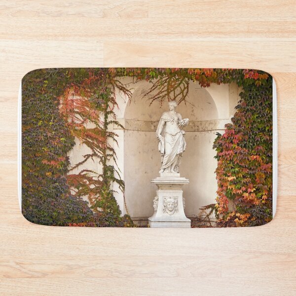Item preview, statue and wall with creeper plant in autumn Vienna  designed and sold by goceris.