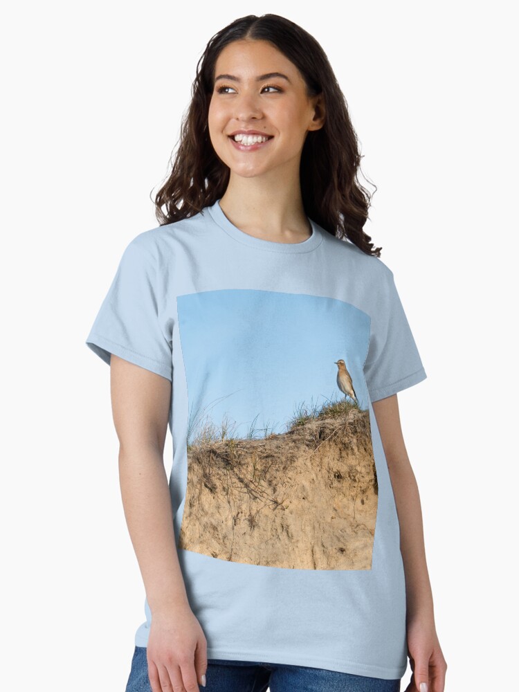 Thumbnail 1 of 7, Classic T-Shirt, Northern wheatear on top of a dune designed and sold by steppeland.