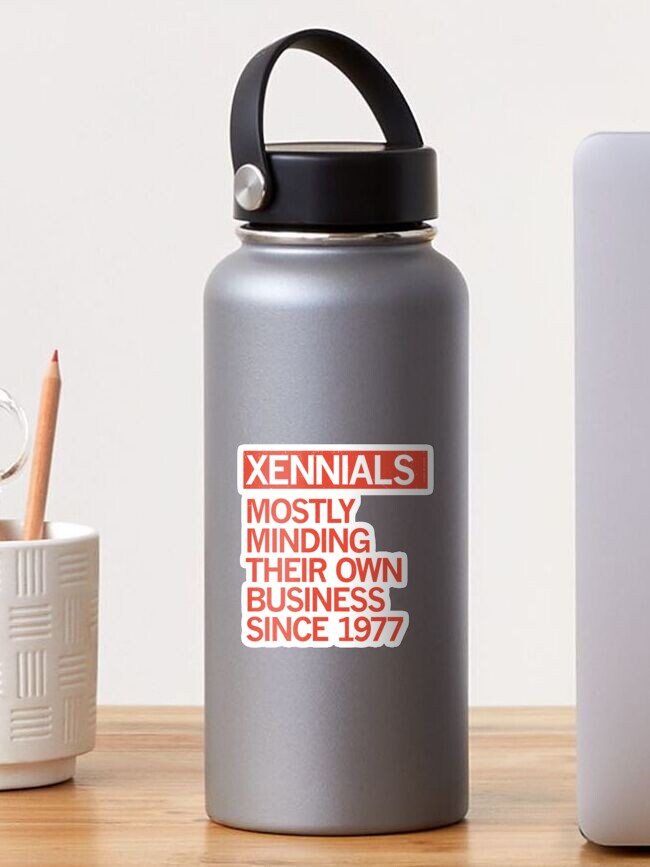Thumbnail 1 of 3, Sticker, XENNIALS — MOSTLY MINDING THEIR OWN BUSINESS SINCE 1977 designed and sold by Carbon13Design.