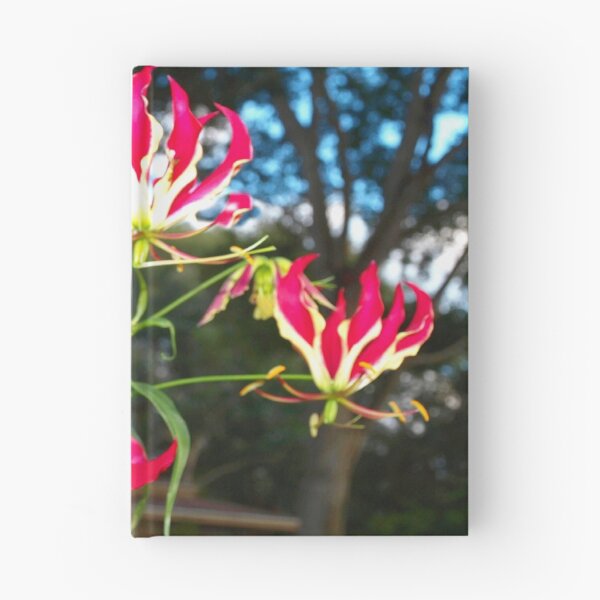 Item preview, Gloriosa lilies against a fence designed and sold by B. Randi Bailey.
