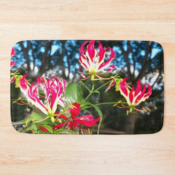 Item preview, Gloriosa lilies against a fence designed and sold by B. Randi Bailey.