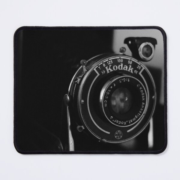 Item preview, Close-up photo of a retro analog camera in black and white designed and sold by Diana van Neck.