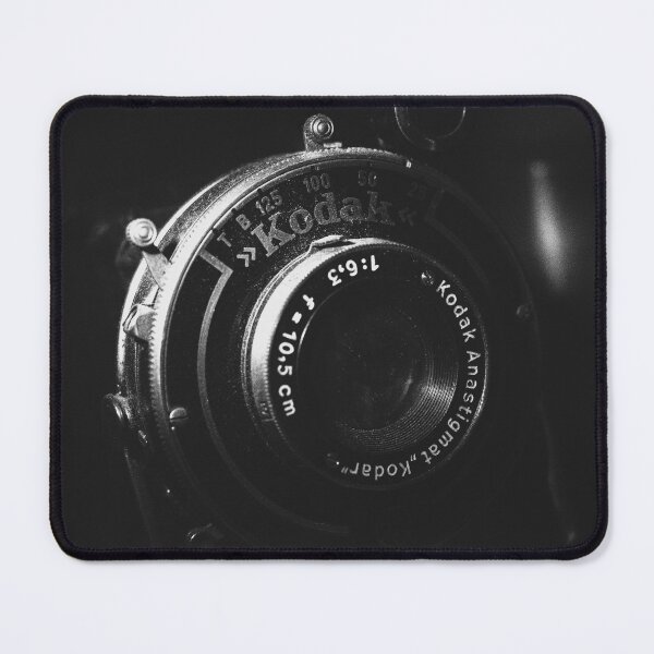 Item preview, A black and white close-up photo of a vintage analog camera designed and sold by Diana van Neck.