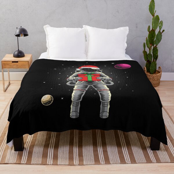 Item preview, Astronaut holding Christmas gift in space designed and sold by WilliamsonMedia.