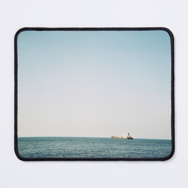 Item preview, 35 mm film photography of a boat in the sea with a clear blue sky designed and sold by Mmm-stuff.