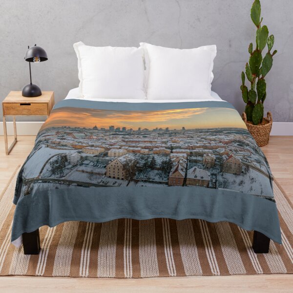 Item preview, Warsaw old town, snow-covered roofs and and distant city center at dusk designed and sold by Lukasz Szczepanski.