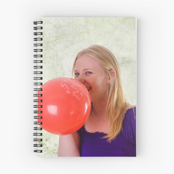Item preview, Young woman blowing red balloon designed and sold by Photopat.