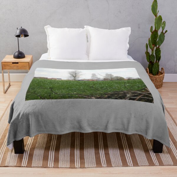 Item preview, Smaller tree branches in front of a green grass landscape designed and sold by BuckridgeHunter.