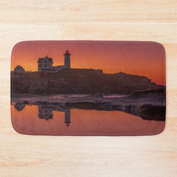 Item preview, Nubble Lighthouse with its reflection at sunrise in Cape Neddick, Maine designed and sold by LindaCPhoto.