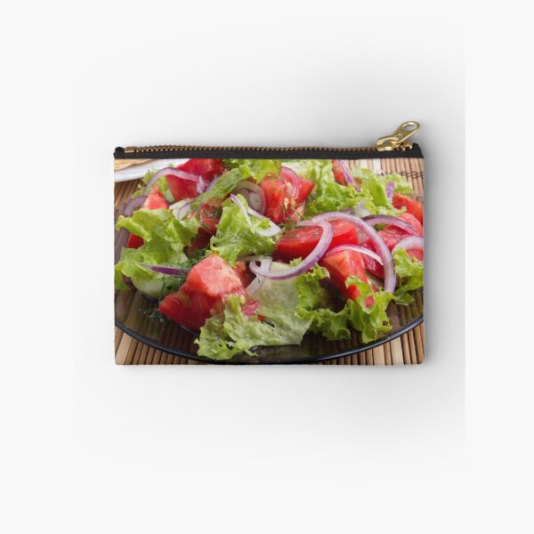 Item preview, Closeup plate with a salad of chopped tomato slices designed and sold by vladromensky.