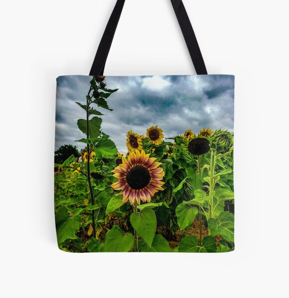 Anime girl with a straw hat in a sunflower field Tote Bag for