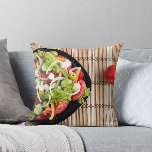 Item preview, Aerial view of one portion of vegetable salad on a plate of black and striped mat designed and sold by vladromensky.