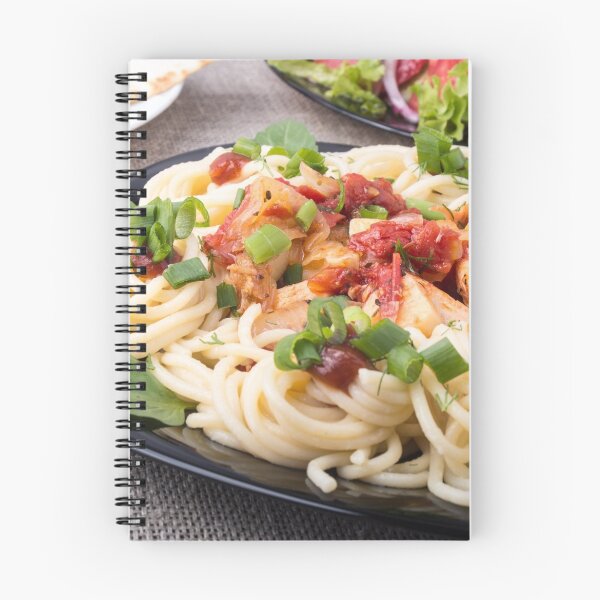 Item preview, Closeup black plate with pasta and slices of braised chicken designed and sold by vladromensky.