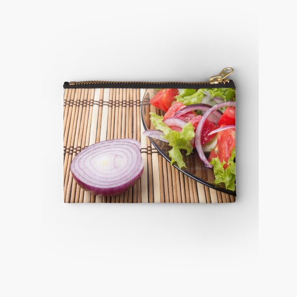 Item preview, Closeup view on a fragment of a translucent plate with a fresh salad designed and sold by vladromensky.