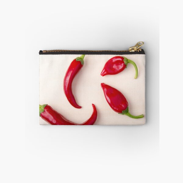Item preview, Hot red chili peppers on a light wooden board designed and sold by vladromensky.