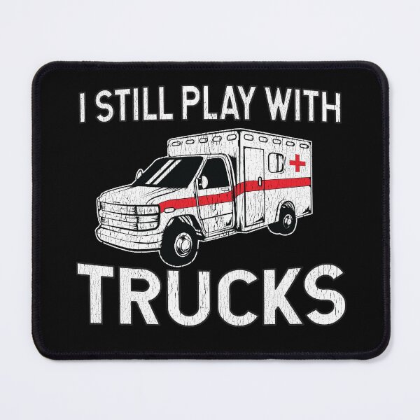 Item preview, I Still Play With Trucks Ambulance designed and sold by teesaurus.