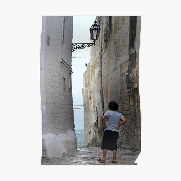 Tourist enjoying a coastal vista, Puglia Poster