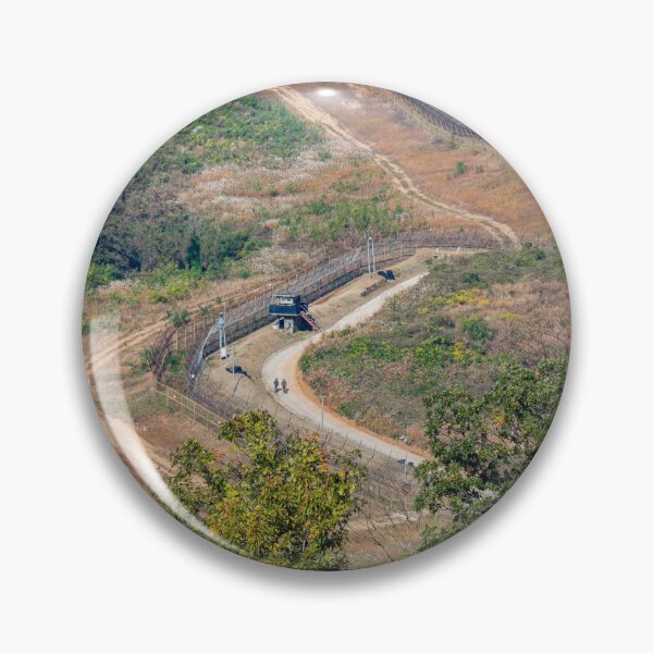 Item preview, Highly fortified border fence at the Korean DMZ, with watch towers, South Korea designed and sold by SnapTPhotograph.