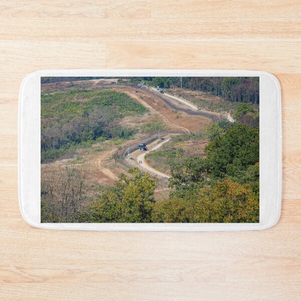 Item preview, Highly fortified border fence at the Korean DMZ, with watch towers, South Korea designed and sold by SnapTPhotograph.