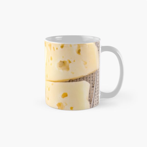 Item preview, Group slices dry hard yellow cheese on a plate designed and sold by vladromensky.