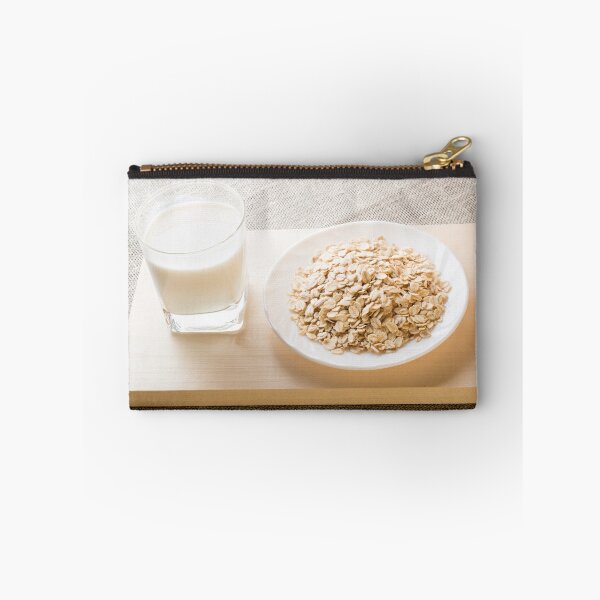 Item preview, Glass of milk and a plate of cereal closeup designed and sold by vladromensky.