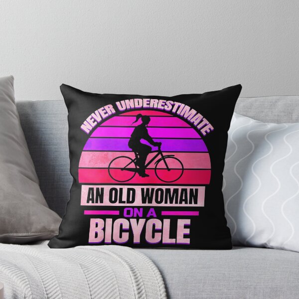 Item preview, Never Underestimate an Old Woman On A Bicycle designed and sold by spherevilla.
