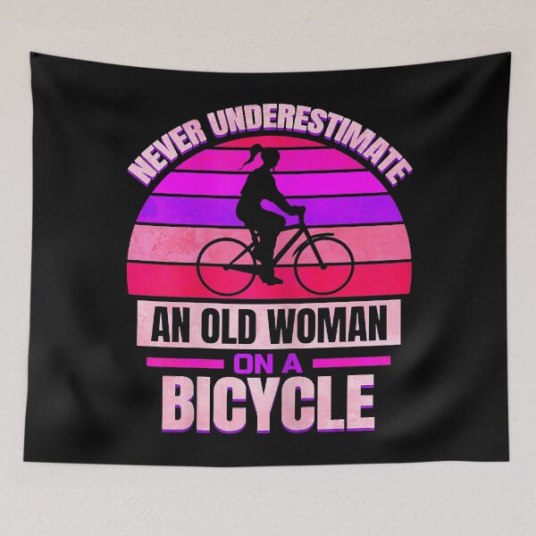 Item preview, Never Underestimate an Old Woman On A Bicycle designed and sold by spherevilla.