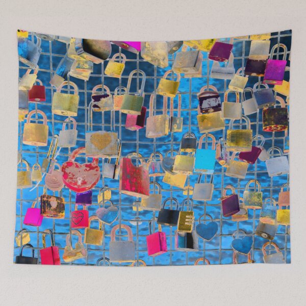 Item preview, Colorful love padlocks as a couples commitment sign hanging  on the fence of the love bridge with a blue background behind designed and sold by IraNiva.