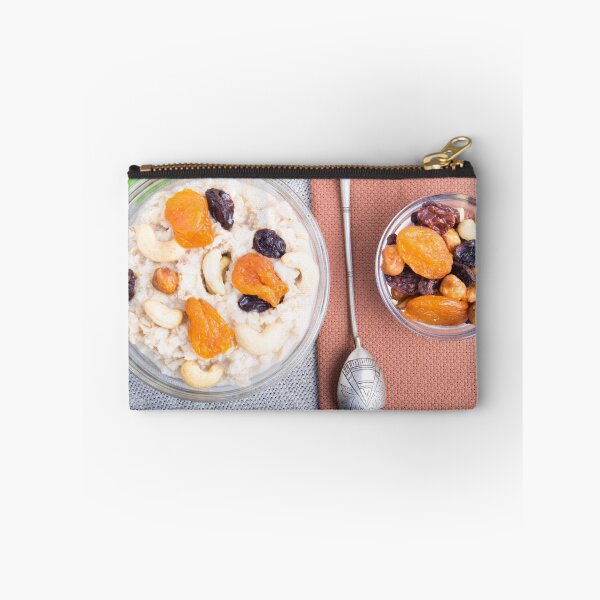 Item preview, Top view of a portion of oatmeal with fruit and berries designed and sold by vladromensky.