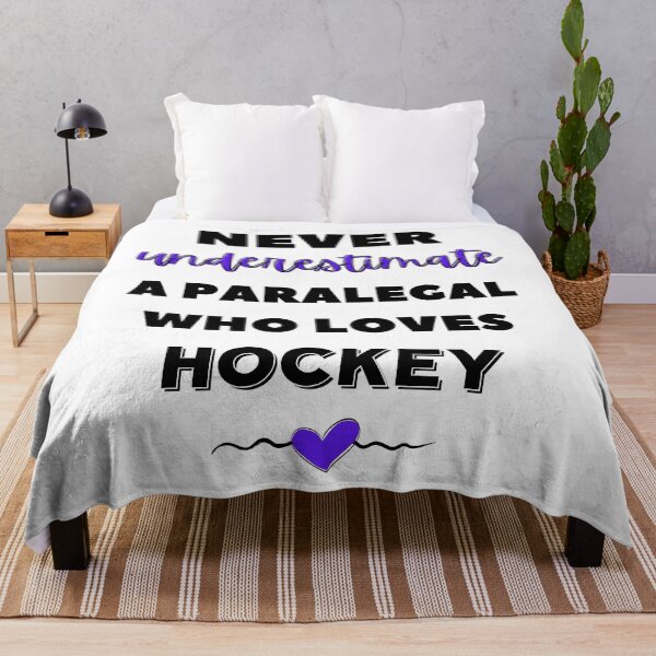 Item preview, Never underestimate a paralegal who loves hockey. designed and sold by TheGreenGoat.
