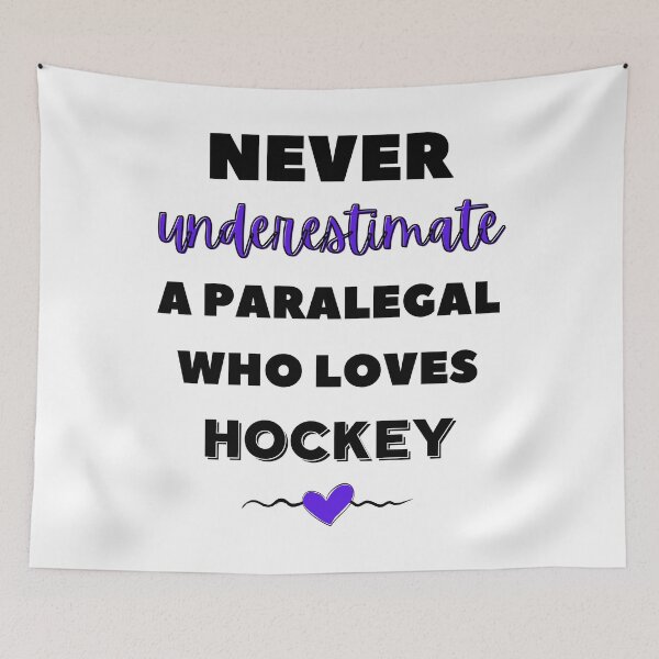 Item preview, Never underestimate a paralegal who loves hockey. designed and sold by TheGreenGoat.