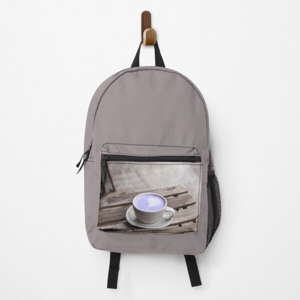 Item preview, Cup of purple latte on a wooden table in a cafe on the street designed and sold by Evgeniia Biriukova.
