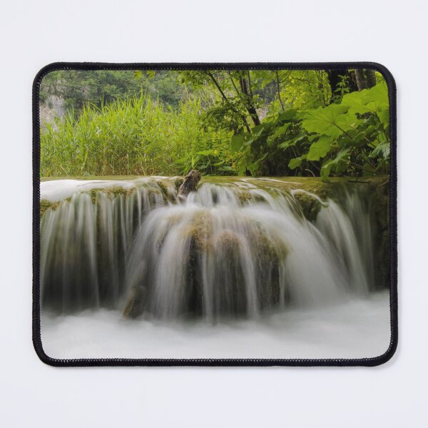 Item preview, Long exposure of water flowing over a small waterfall at Plivice Lakes, UNESCO World Heritage Site, Croatia designed and sold by SnapTPhotograph.