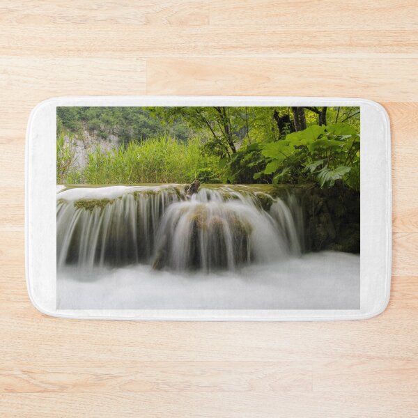 Item preview, Long exposure of water flowing over a small waterfall at Plivice Lakes, UNESCO World Heritage Site, Croatia designed and sold by SnapTPhotograph.