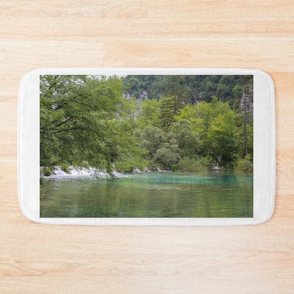 Item preview, A lake at Plitvice Lakes, with a waterfall and woodland in the background, Croatia designed and sold by SnapTPhotograph.
