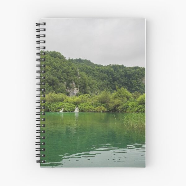 Item preview, A view of a green lake over reeds with a waterfall and mountain in the background, Plitvice Lakes, Croatia designed and sold by SnapTPhotograph.