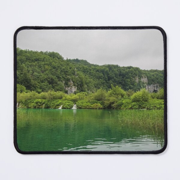 Item preview, A view of a green lake over reeds with a waterfall and mountain in the background, Plitvice Lakes, Croatia designed and sold by SnapTPhotograph.