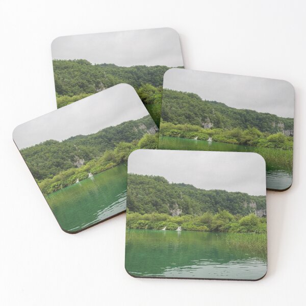 Item preview, A view of a green lake over reeds with a waterfall and mountain in the background, Plitvice Lakes, Croatia designed and sold by SnapTPhotograph.