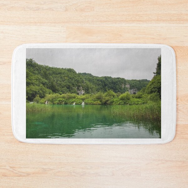 Item preview, A view of a green lake over reeds with a waterfall and mountain in the background, Plitvice Lakes, Croatia designed and sold by SnapTPhotograph.
