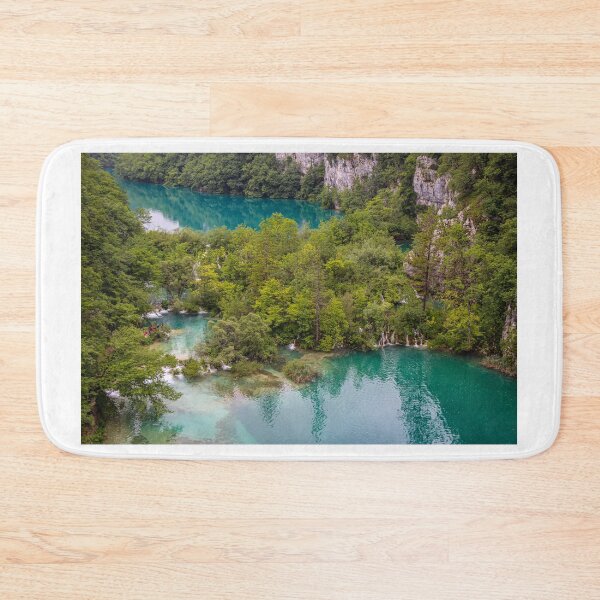 Item preview, Water flowing through submerged trees between two lakes at Plitvice Lakes, Croatia designed and sold by SnapTPhotograph.