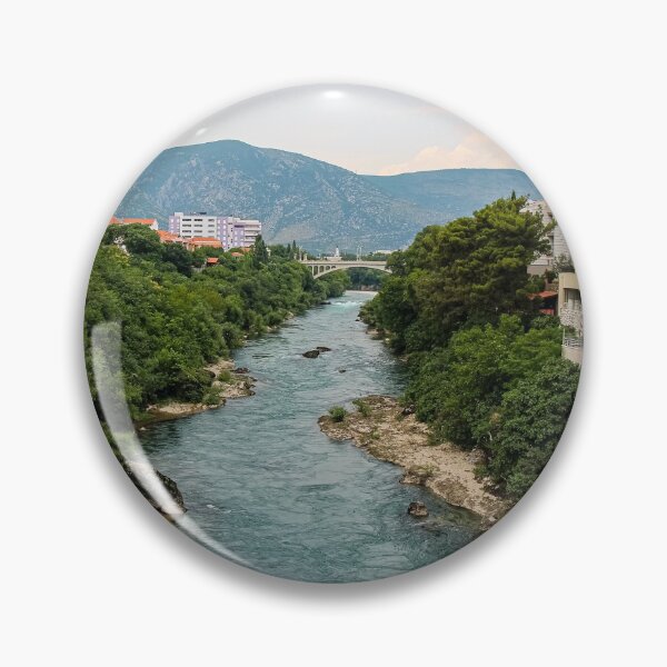 Item preview, The treelined fast flowing Neretva river in Mostar, with Rastani mountains in the background, Bosnia and Herzegovina designed and sold by SnapTPhotograph.