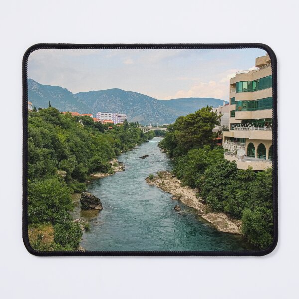 Item preview, The treelined fast flowing Neretva river in Mostar, with Rastani mountains in the background, Bosnia and Herzegovina designed and sold by SnapTPhotograph.