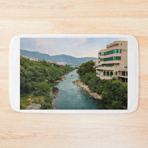 Item preview, The treelined fast flowing Neretva river in Mostar, with Rastani mountains in the background, Bosnia and Herzegovina designed and sold by SnapTPhotograph.