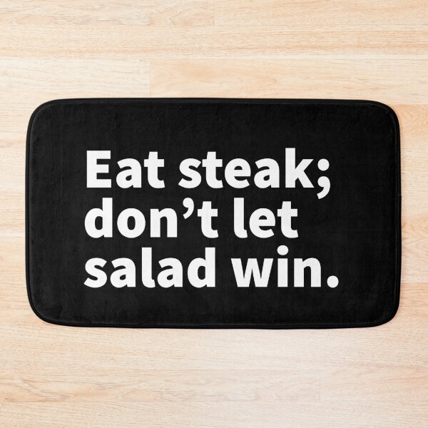 Item preview, Bold white text design saying “Eat steak; don’t let salad win.” On a T-shirt, sticker, apron and more. designed and sold by PlainCrankyT.