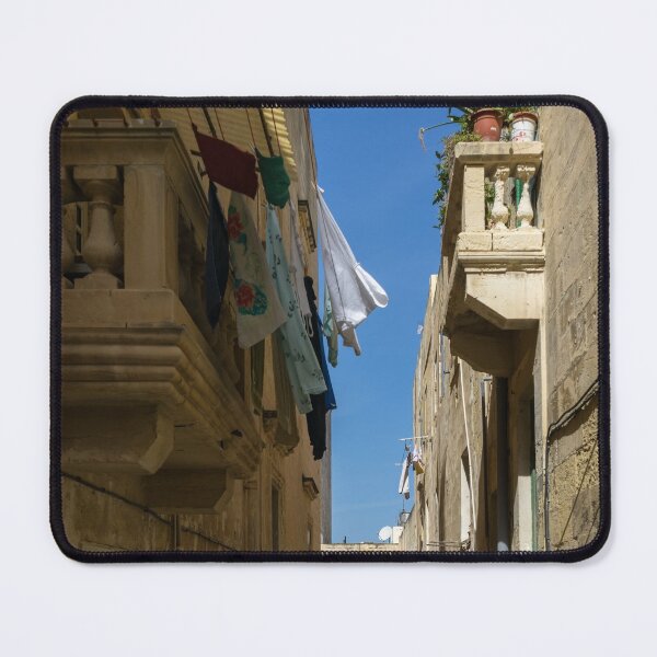 Item preview, Gallivanting Around Valletta Malta - Charming Narrow Street with Drying Laundry designed and sold by Georgia Mizuleva.