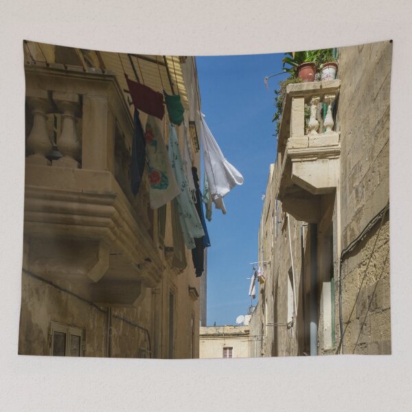 Item preview, Gallivanting Around Valletta Malta - Charming Narrow Street with Drying Laundry designed and sold by Georgia Mizuleva.