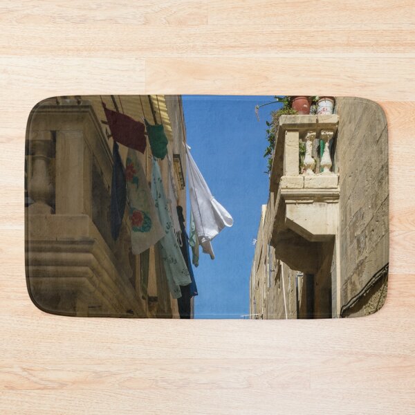Item preview, Gallivanting Around Valletta Malta - Charming Narrow Street with Drying Laundry designed and sold by Georgia Mizuleva.