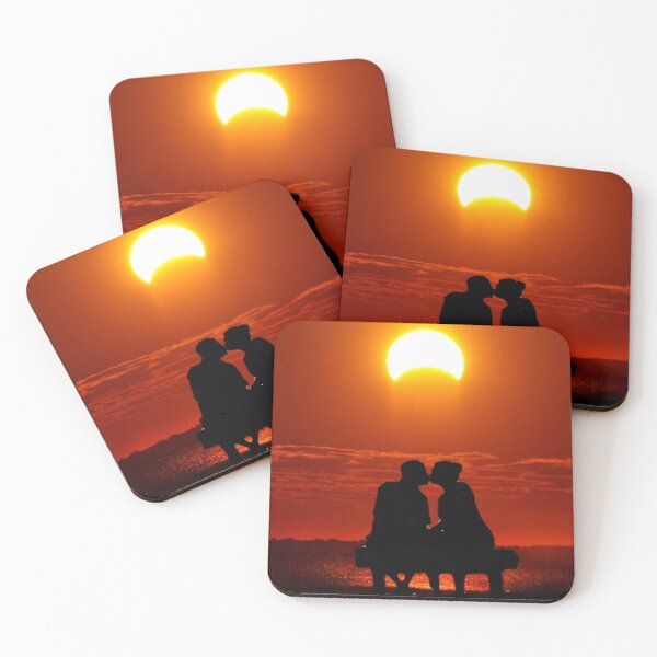 Item preview, Couples kissing on a bench overlooking the beach with the moon covering the sun and makinga beautiful orange red glow on the sky and water designed and sold by Spasija.