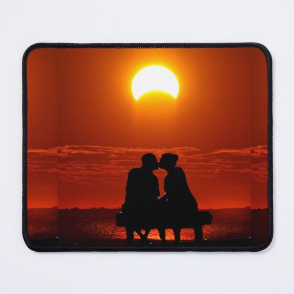 Item preview, Couples kissing on a bench overlooking the beach with the moon covering the sun and makinga beautiful orange red glow on the sky and water designed and sold by Spasija.